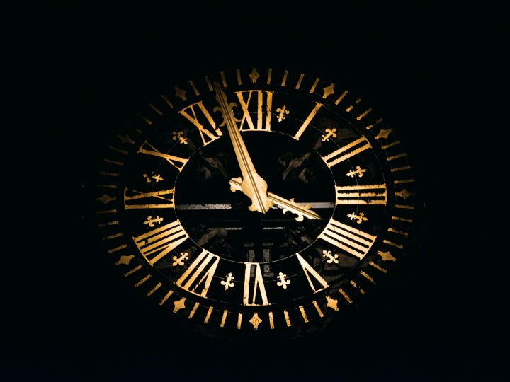 round black and brown analog clock